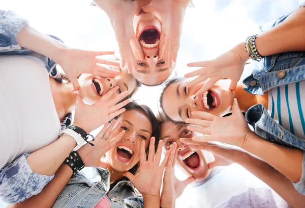 Group of teenagers looking down and screaming Royalty Free Stock Photos