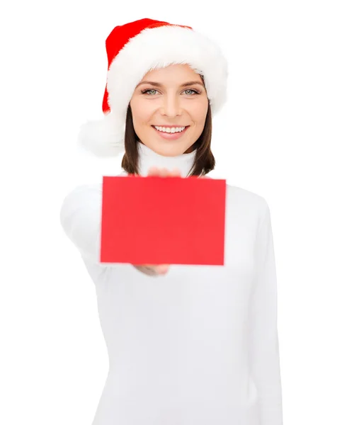 Kvinna i santa helper hatt med tomt rött kort — Stockfoto