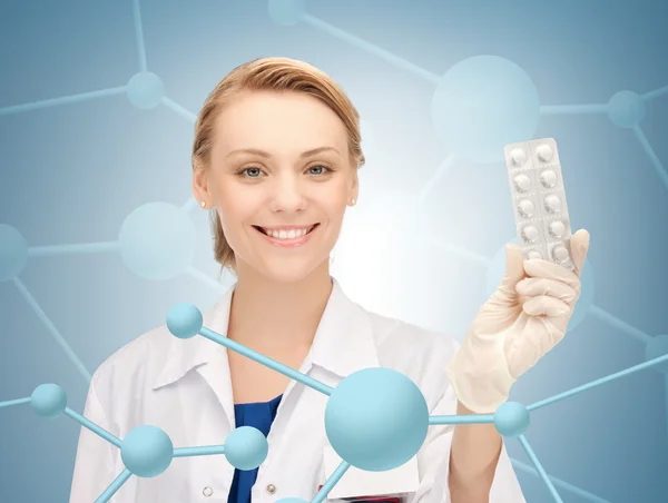 Attractive female doctor with pills — Stock Photo, Image