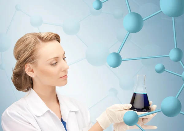 Lab worker holding up test tube — Stock Photo, Image