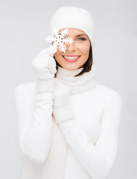 Woman with big snowflake — Stock Photo, Image