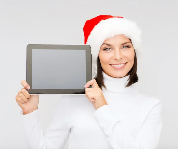 Mujer en sombrero de ayudante de santa con la tableta pc — Foto de Stock