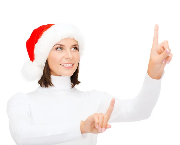 Mujer en santa helper sombrero presionando botón vitrual —  Fotos de Stock