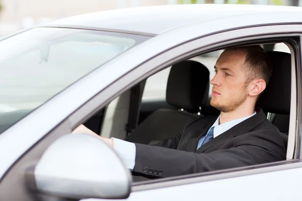 Businessman driving a car — Stock Photo, Image