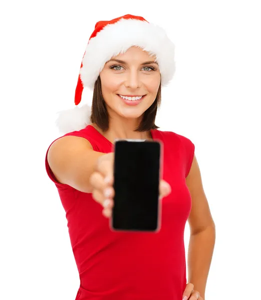 Vrouw in helper kerstmuts met smartphone — Stockfoto