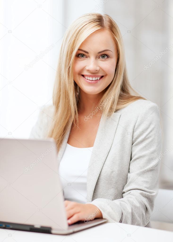 businesswoman with laptop in office — stock phot