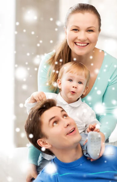 Happy parents playing with adorable baby Stock Picture