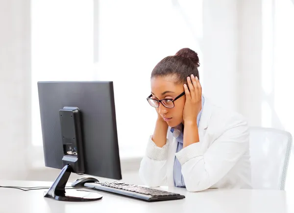 Stressed african woman with computer — Stock Photo, Image