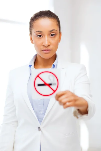 African woman with restriction no smoking sign — Stock Photo, Image