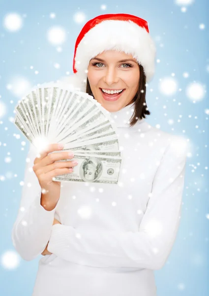 Donna in cappello Babbo Natale aiutante con noi soldi dollari — Foto Stock