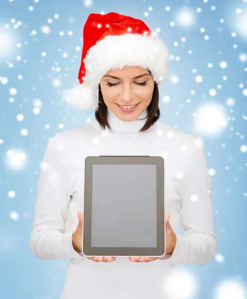 Mujer en sombrero de ayudante de santa con la tableta pc —  Fotos de Stock