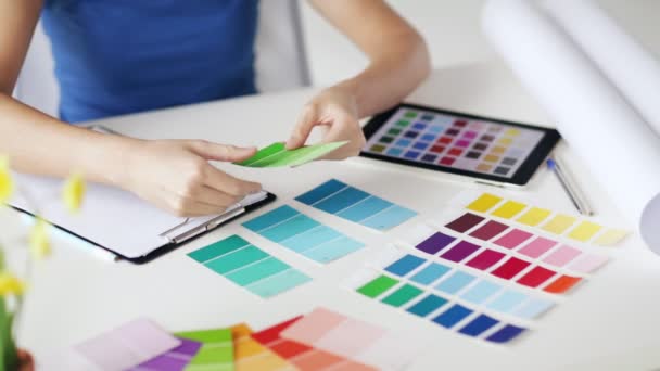 Woman working with color samples for selection — Stock Video