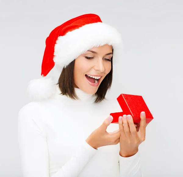 Surprised woman in santa helper hat with gift box — Stock Photo, Image