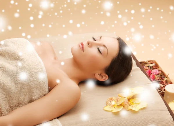 Woman in spa salon lying on the massage desk — Stock Photo, Image