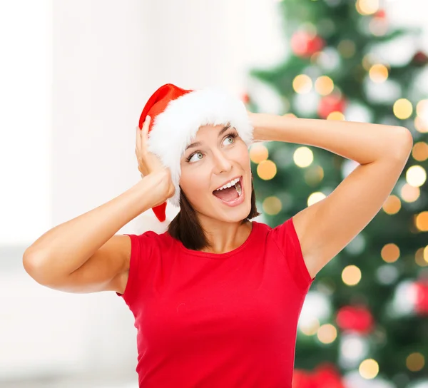 Surprised woman in santa helper hat — Stock Photo, Image