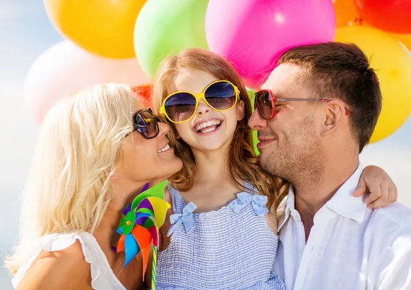 Family with colorful balloons — Stock Photo, Image