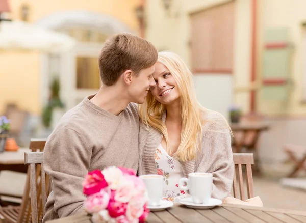 Romantic happy couple kissing in the cafe — Stock Photo, Image