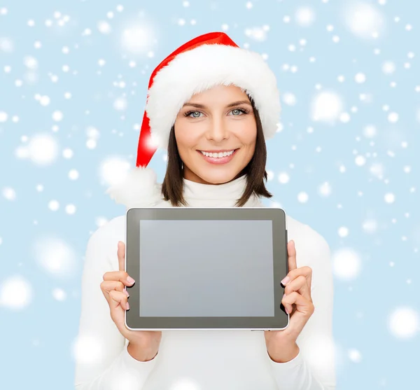 Mujer en sombrero de ayudante de santa con la tableta pc — Foto de Stock