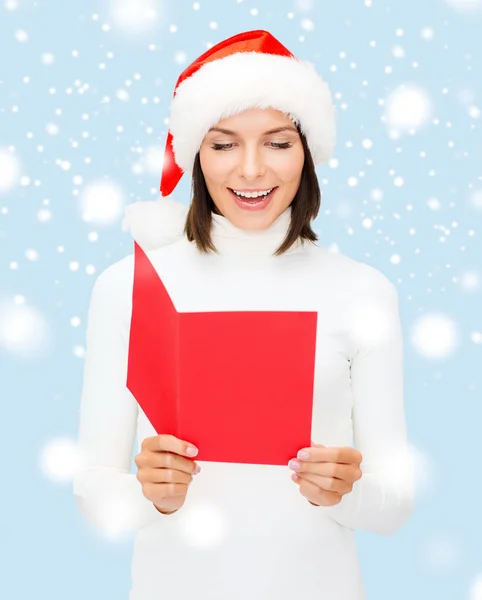 Cappello donna in Babbo Natale con cartolina bianca rossa — Foto Stock