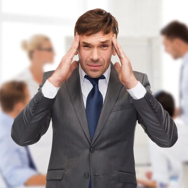 Stressed buisnessman or teacher having headache — Stock Photo, Image