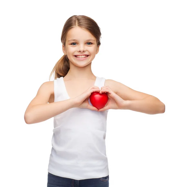 Girl in blank white shirt with small red heart Stock Photo