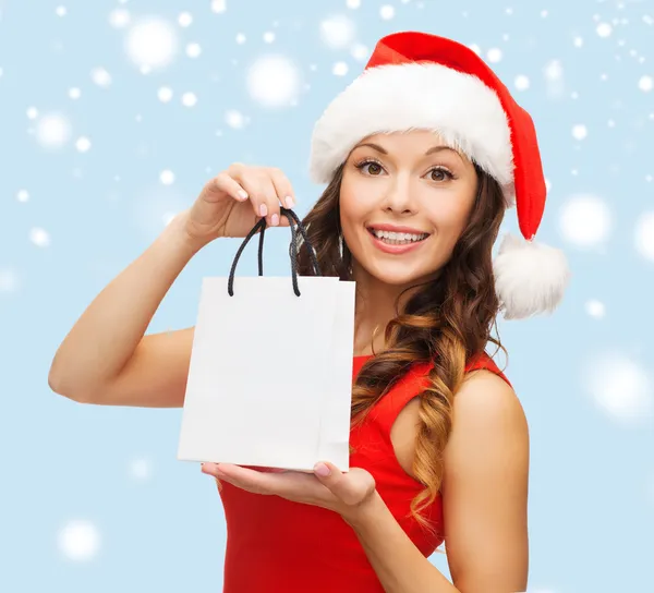 Woman in red dress with shopping bag — Stock Photo, Image