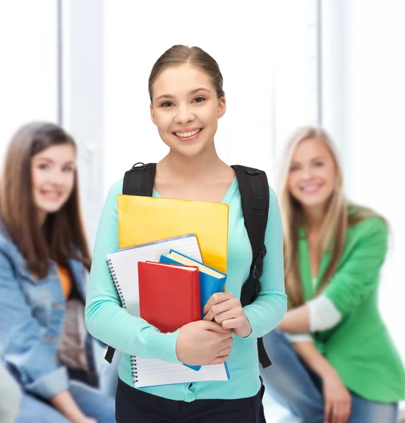 Student with books and schoolbag — Stock Photo, Image