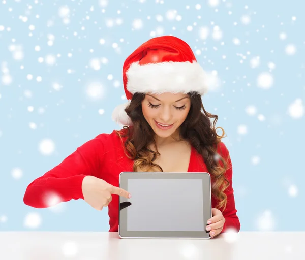 Vrouw in helper kerstmuts met tablet pc — Stockfoto
