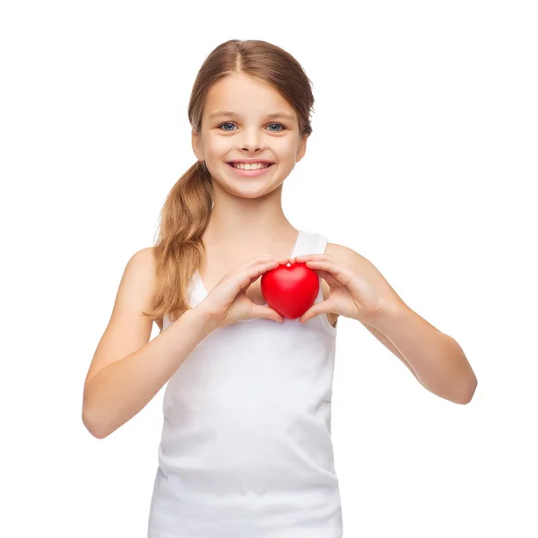 Girl in blank white shirt with small red heart — Stock Photo, Image