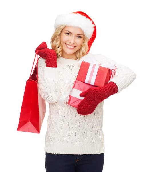 Woman in santa helper hat with shopping bags — Stock Photo, Image