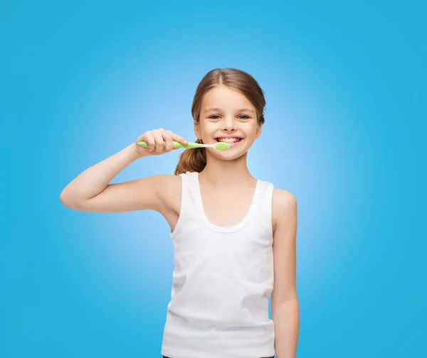 Lány az üres fehér ing foga fogmosás — Stock Fotó