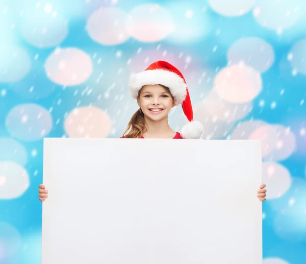 Frau mit Weihnachtsmann-Helfermütze mit weißem Brett — Stockfoto