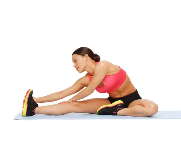 Sporty woman doing exercise on the floor — Stock Photo, Image