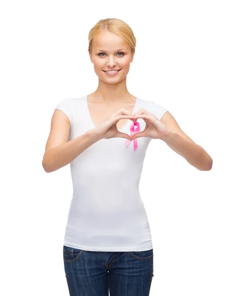 Woman in blank t-shirt with pink cancer ribbon — Stock Photo, Image