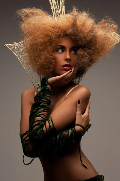 Woman with long curly hair in crown — Φωτογραφία Αρχείου