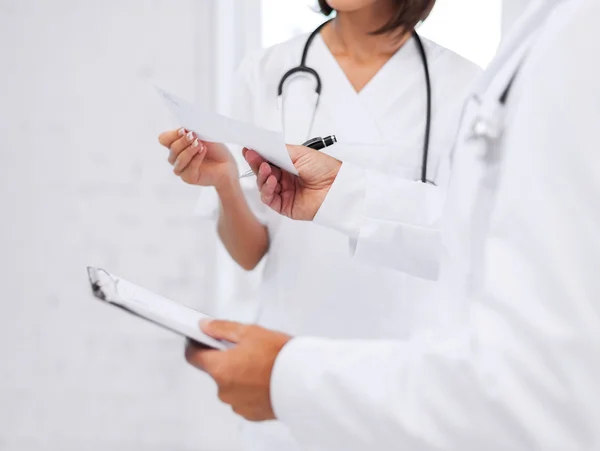 Two doctors writing prescription — Stock Photo, Image