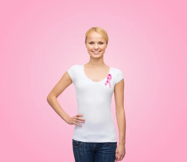 Woman in blank t-shirt with pink cancer ribbon — Stock Photo, Image