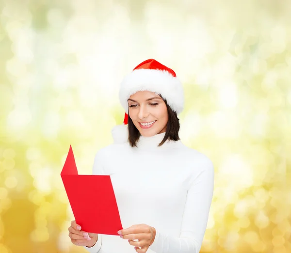 Cappello donna in Babbo Natale con cartolina bianca rossa — Foto Stock