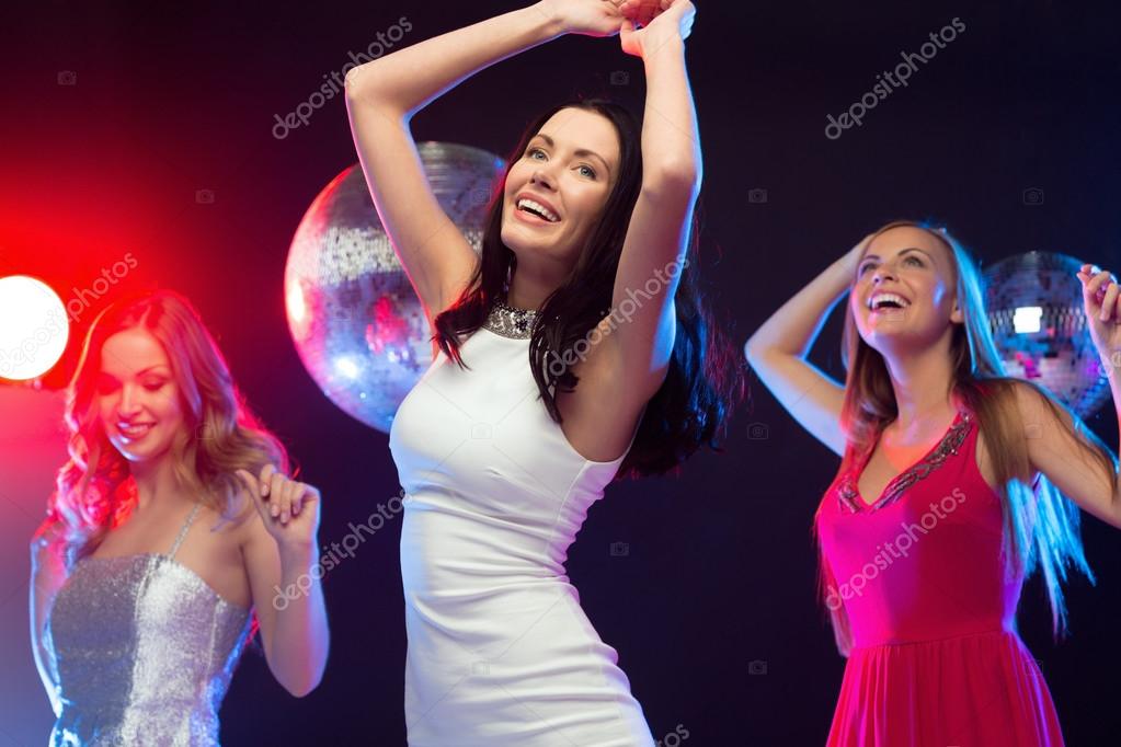 Three smiling women dancing in the club — Stock Photo © Syda ...