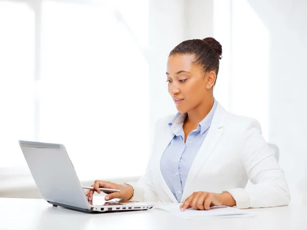 African businesswoman writing something — Stock Photo, Image