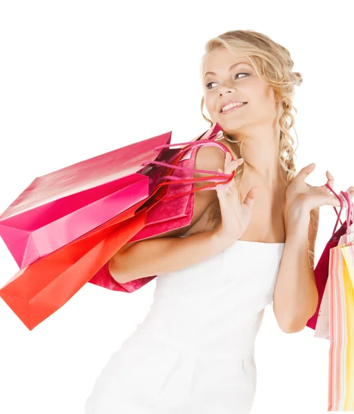 Foto de mujer feliz con bolsas de compras —  Fotos de Stock