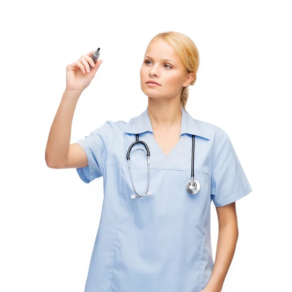 Doctor or nurse working with something imaginary Stock Picture