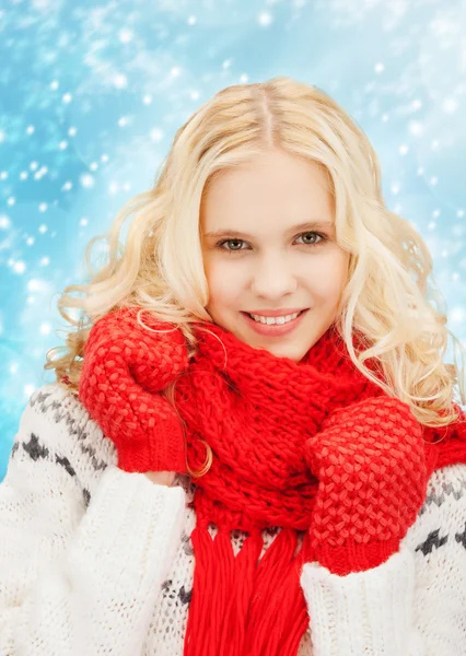 Smiling teenage girl in red mittens and scarf — Stock Photo, Image