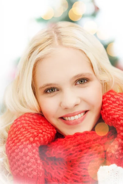 Smiling teenage girl in red mittens and scarf — Stock Photo, Image