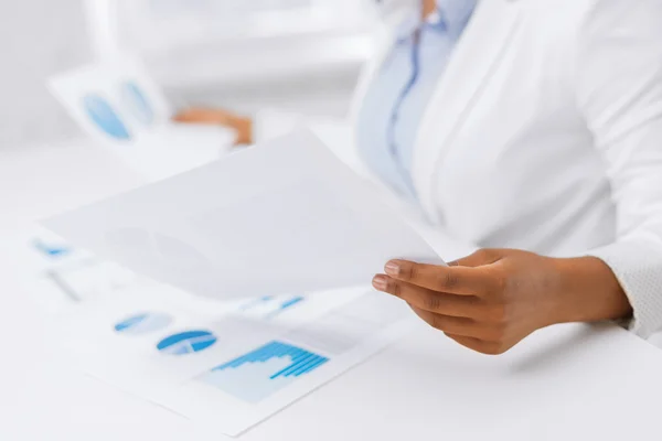 Woman hands with charts and papers — Stock Photo, Image