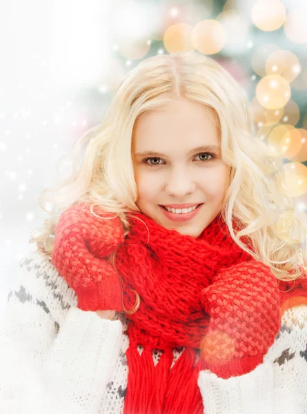 Smiling teenage girl in red mittens and scarf — Stock Photo, Image