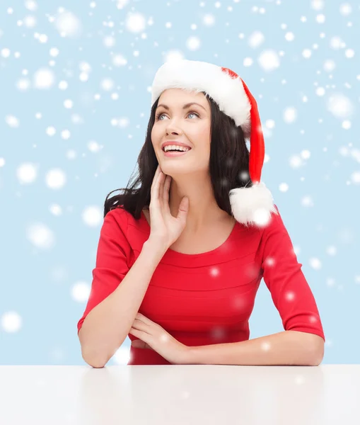 Surprised woman in santa helper hat looking up — Stock Photo, Image