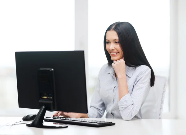 Smiling businesswoman or student with computer — Stock Photo, Image