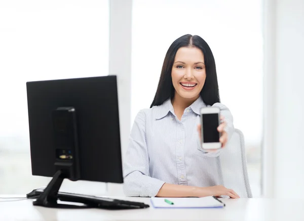 Smiling businesswoman or student with smartphone — Stock Photo, Image