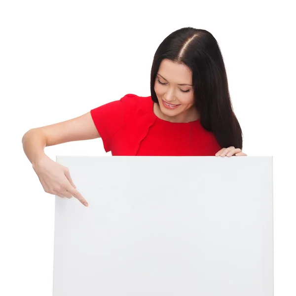 Smiling young woman with blank white board — Stock Photo, Image